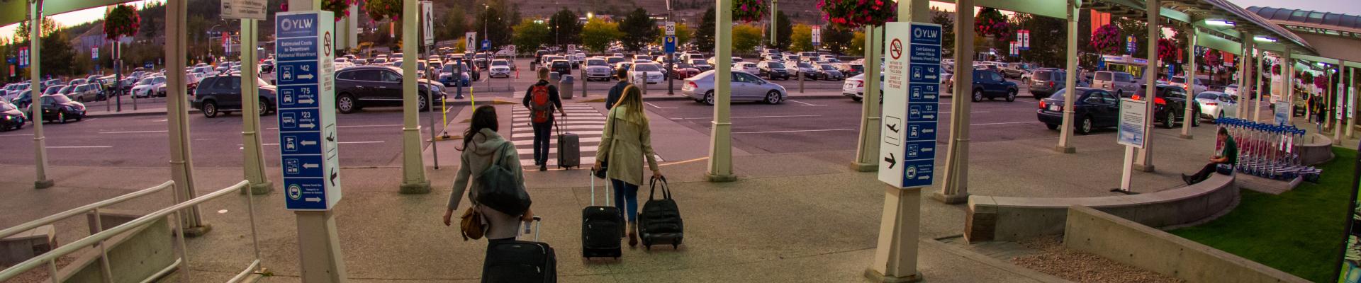 Passengers leaving the terminal at sunset